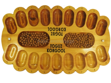 Toguz Korgool kirgiska gra logiczno-matematyczna, plansza z drewna z World Nomad Games III