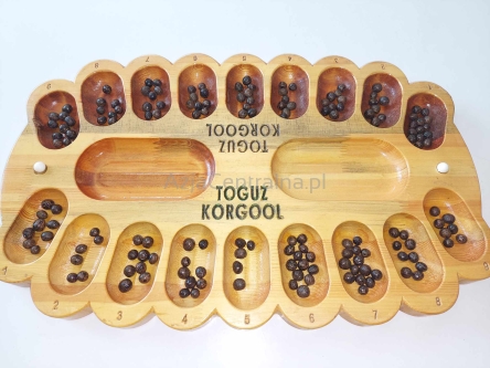 Toguz Korgool kirgiska gra logiczno-matematyczna, plansza z drewna z World Nomad Games III